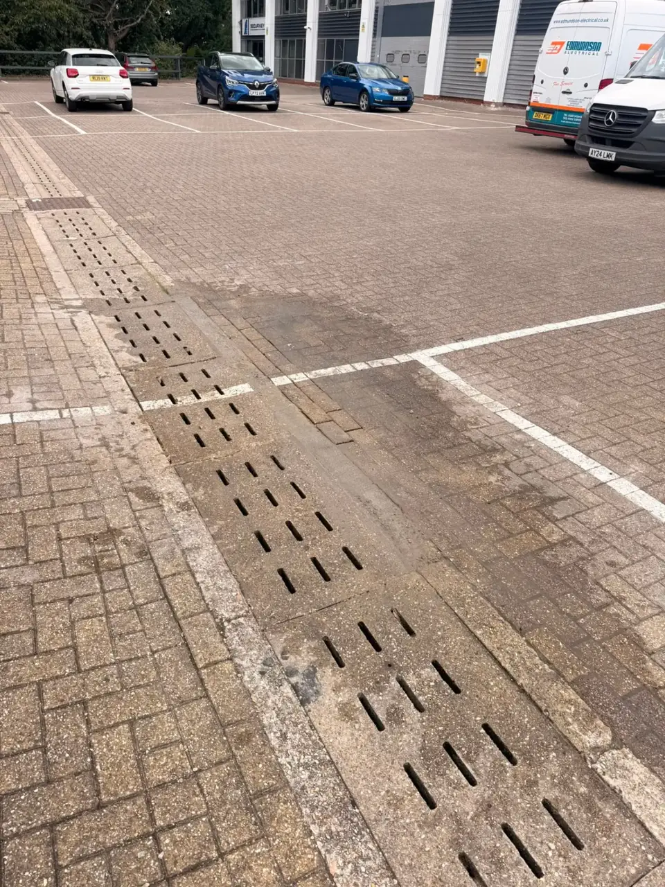 Completed slot drainage across a commercial car park
