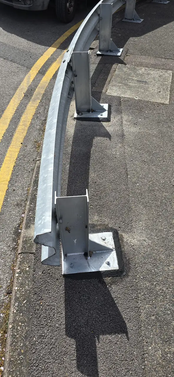 Galvanised crash barrier installation on a service road